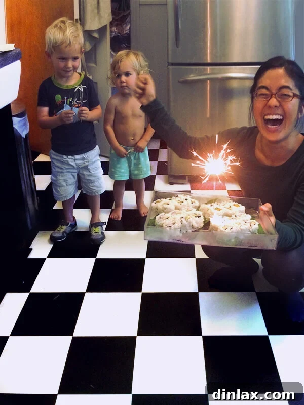 Homemade Granola Bars for Back-to-School 4 Hana, the thoughtful babysitter, holding a tray of sushi with a sparkler.