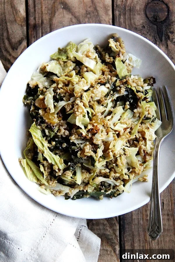 A vibrant Freekeh Salad with roasted kale and cabbage, embodying a light yet comforting meal, perfect for any season. The dish features a colorful mix of greens and grains, promising minimal mess and maximum flavor. alexandracooks.com