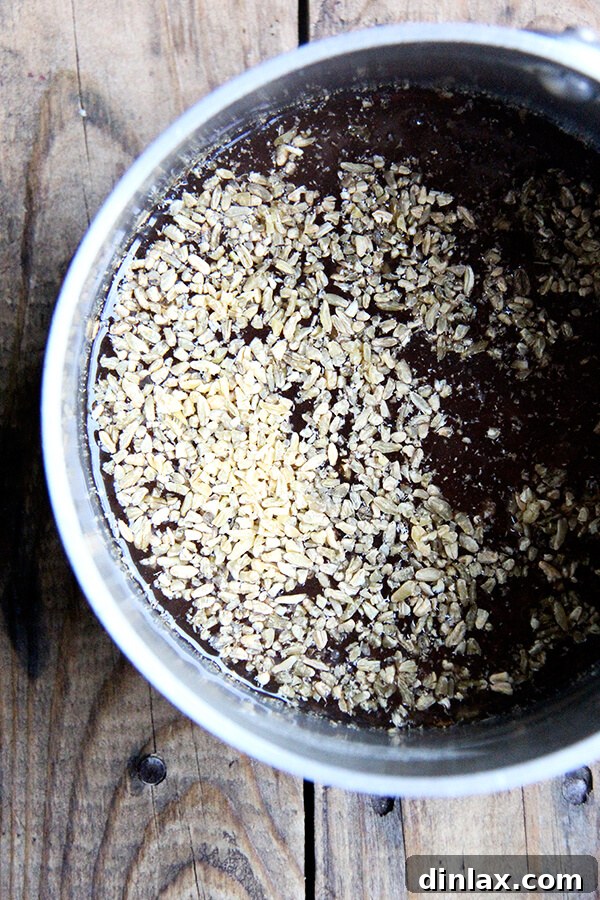 Mediterranean Freekeh Salad with Roasted Kale and Cabbage 7 Freekeh cooking in vegetable stock on the stovetop, demonstrating the simmering process where the grains absorb the liquid, becoming tender and flavorful.