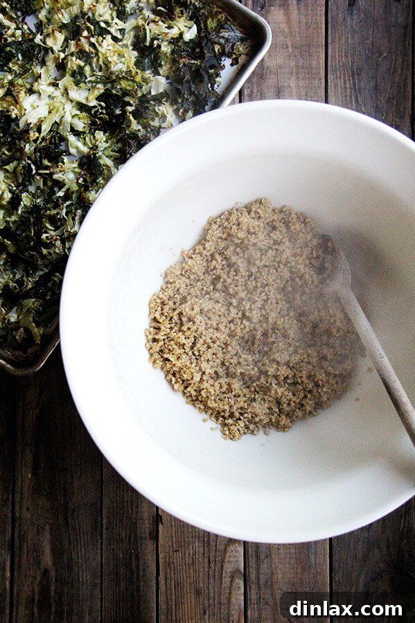 Mediterranean Freekeh Salad with Roasted Kale and Cabbage 8 Cooked freekeh, still warm and fluffy after absorbing the broth, showcasing its readiness to be mixed into the salad.