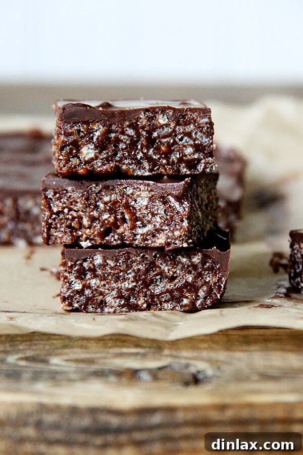 Deliciously gooey and rich Hippie Crispy Treats, a grown-up version of classic crispy rice bars, showcasing their irresistible texture and perfect for a Fair Trade celebration.