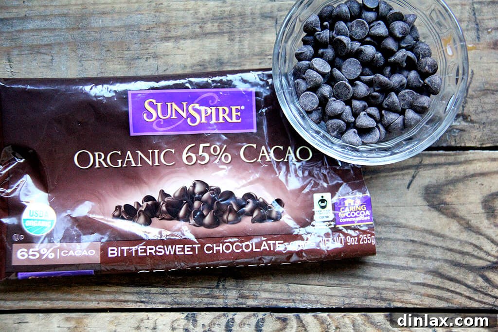 Close-up of Sunspire Fair Trade chocolate chips, an ideal and ethically sourced ingredient for adding rich flavor to Hippie Crispy Treats.