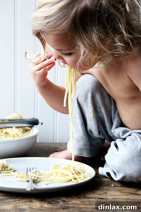 Roman Cheese and Pepper Pasta 9 Enjoying a bite of Cacio e Pepe, savoring the rich, peppery, and cheesy flavors.