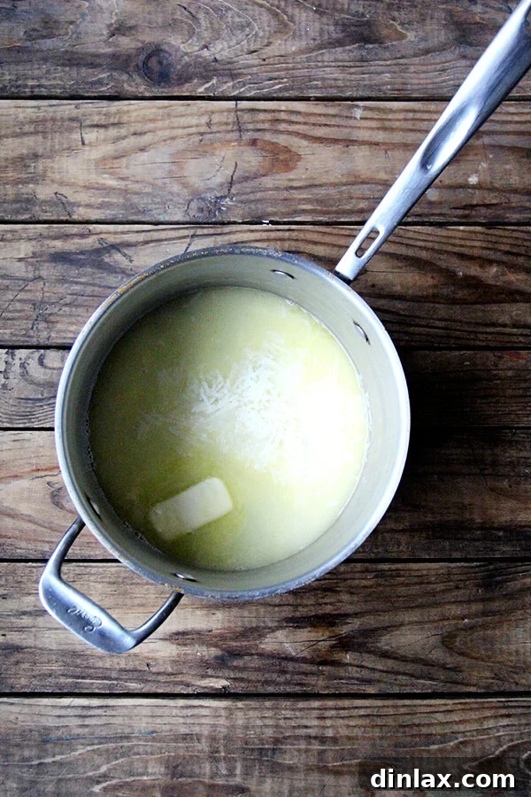 Roman Cheese and Pepper Pasta 4 The creamy Cacio e Pepe sauce forming in a pan with butter, cheese, and starchy pasta water.