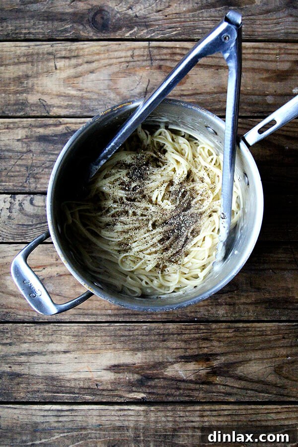 Roman Cheese and Pepper Pasta 5 A pot filled with perfectly coated Cacio e Pepe pasta, ready to be served.