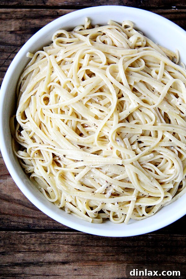 Roman Cheese and Pepper Pasta 7 A beautifully plated bowl of Cacio e Pepe, garnished with extra black pepper and cheese.