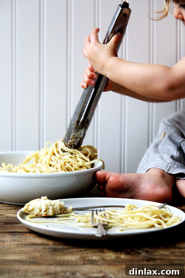 Roman Cheese and Pepper Pasta 8 A fork expertly twirling Cacio e Pepe, highlighting the perfect coating of sauce on the spaghetti.