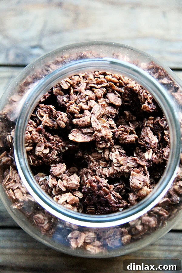 A glass jar filled with homemade cocoa crunch, perfect for storage or gifting.