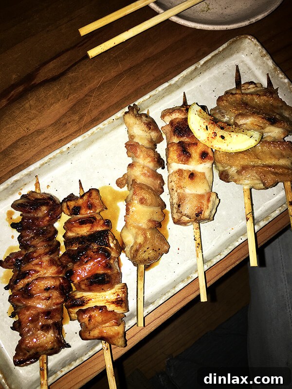 Cookbook Shoot Secrets and Bay Area Food Finds 13 A spread of various yakitori skewers, including chicken, vegetables, and other delicacies, served with drinks at Ippuku in Berkeley.