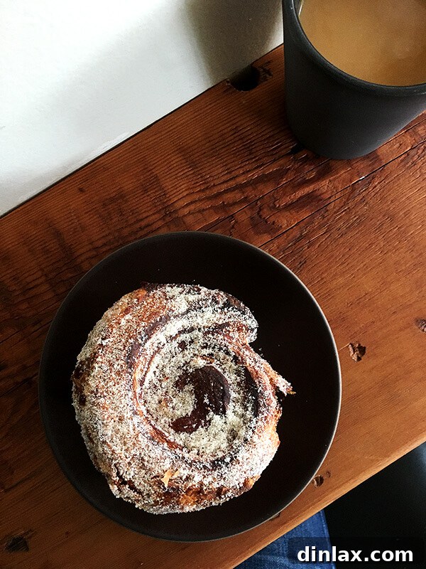 Cookbook Shoot Secrets and Bay Area Food Finds 20 A golden, flaky morning bun with a sweet glaze, served on a simple white plate at Pizzaiolo.