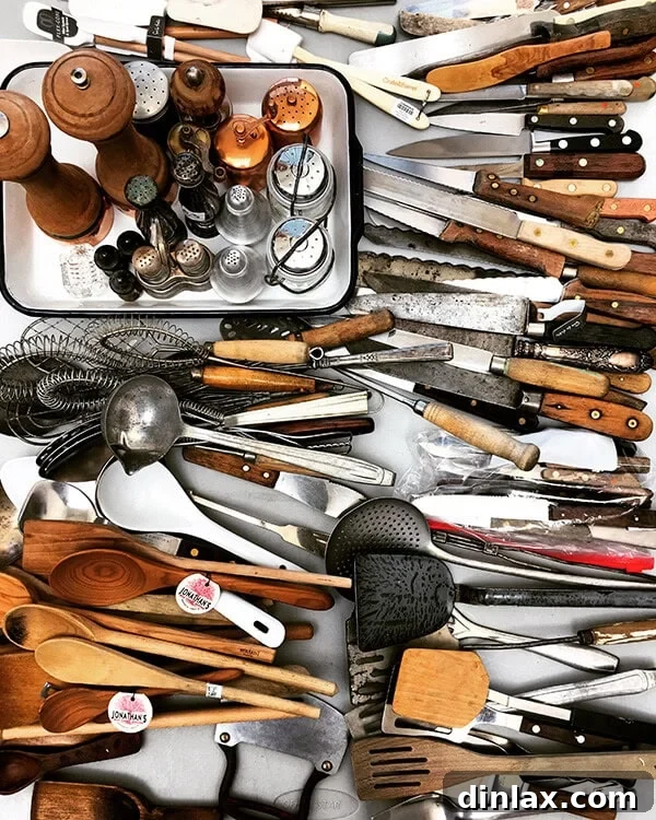 Cookbook Shoot Secrets and Bay Area Food Finds 3 An assortment of vintage and modern kitchen utensils, including spoons, spatulas, and whisks, neatly arranged as props for a food photo shoot.