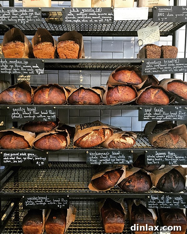 Cookbook Shoot Secrets and Bay Area Food Finds 22 The bright and minimalist interior of The Mill in San Francisco, showcasing its high ceilings and warm lighting.