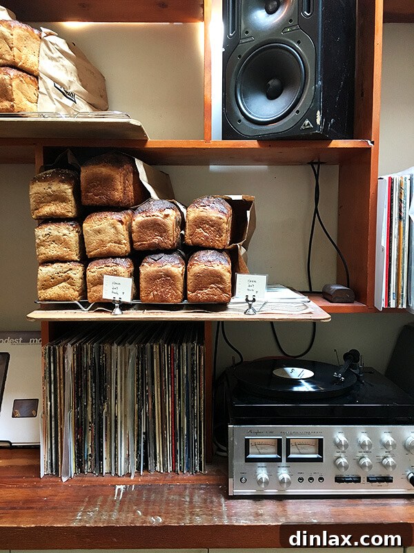 Cookbook Shoot Secrets and Bay Area Food Finds 23 A close-up of freshly baked artisan bread loaves displayed on shelves at The Mill, San Francisco.