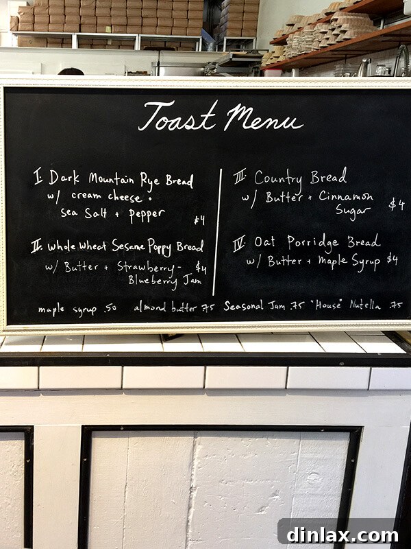 Cookbook Shoot Secrets and Bay Area Food Finds 24 A rustic menu board showcasing various toast options and prices at The Mill, San Francisco.