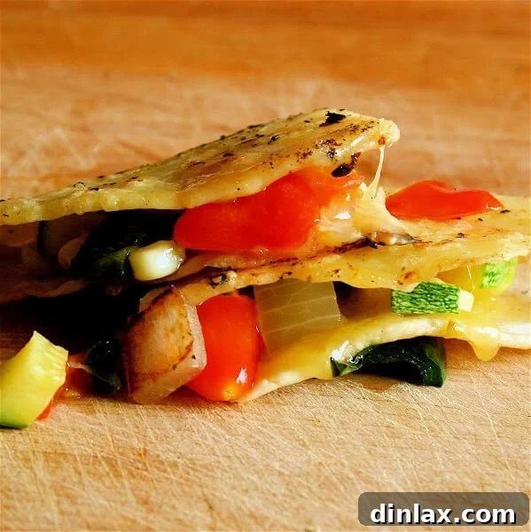 A vibrant close-up of a freshly made Farmers' Market Quesadilla, showcasing a golden-brown tortilla filled with colorful, sautéed vegetables like corn, zucchini, poblano peppers, and cherry tomatoes, alongside melted cheddar cheese and fresh basil. The image highlights the texture and freshness of the ingredients, inviting viewers to experience its deliciousness.