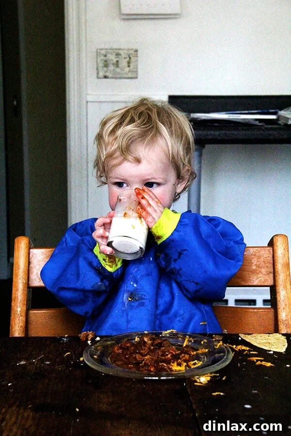 Tig, drinking milk and eating tacos. 