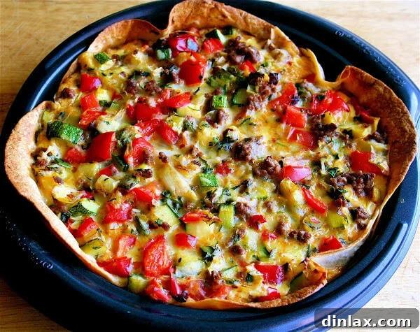 Reinvent Leftover Tortillas Quiche Perfection 6 A slice of the finished tortilla quiche on a plate, revealing its layers of filling and golden-brown crust.