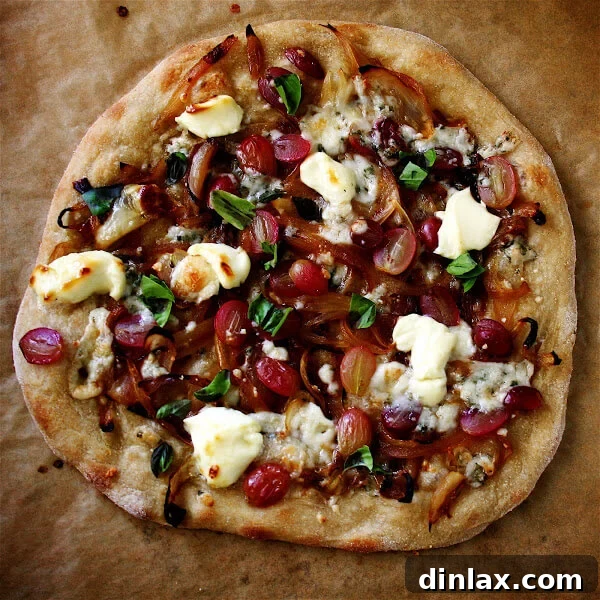 The ultimate homemade thin-crust pizza, fresh from a wood-burning oven, paired with a crisp Caesar salad and a fine glass of wine.