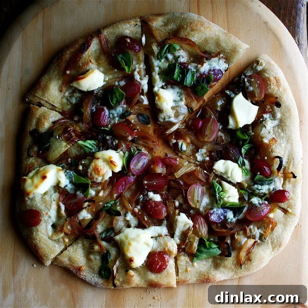 Another perfectly baked thin-crust pizza, ready to be sliced and enjoyed, with a focus on its delicate, crispy texture.