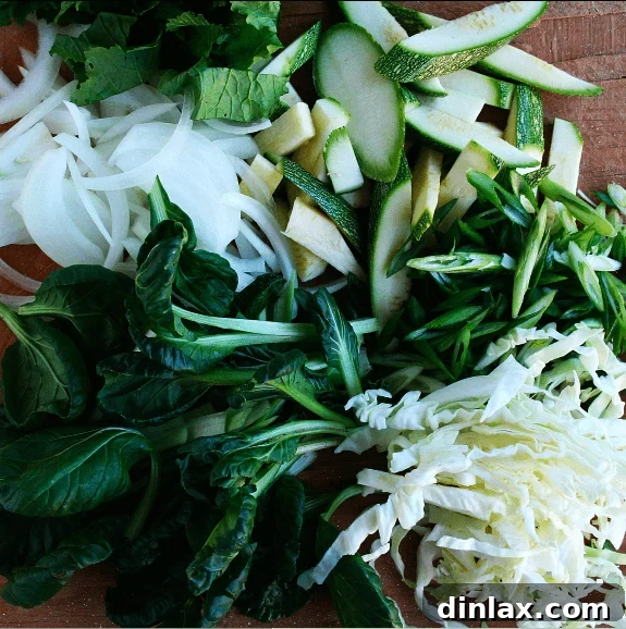 Finely chopped vegetables on a cutting board, demonstrating uniform cuts ready for stir-frying.