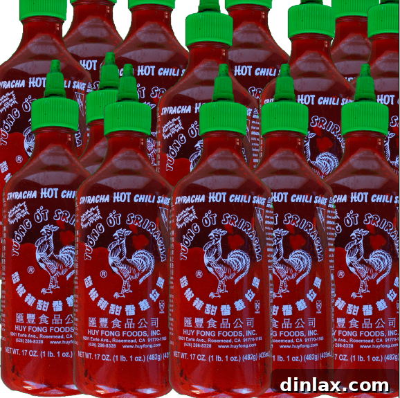 A bottle of Sriracha hot sauce, a popular condiment for adding heat to stir-fries.