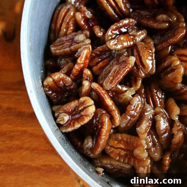 Pecans simmering in a sugar syrup