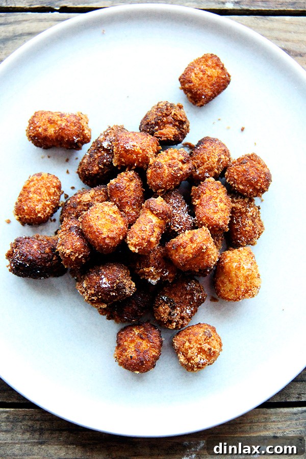 Roman Semolina Gnocchi Bake 14 A plate of freshly fried semolina croquettes, seasoned and ready to be enjoyed as a savory snack or second course.