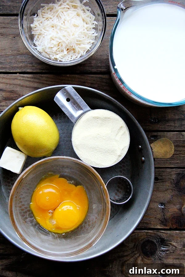 Roman Semolina Gnocchi Bake 2 Ingredients for baked semolina gnocchi laid out, including semolina flour, milk, parmesan cheese, and eggs.