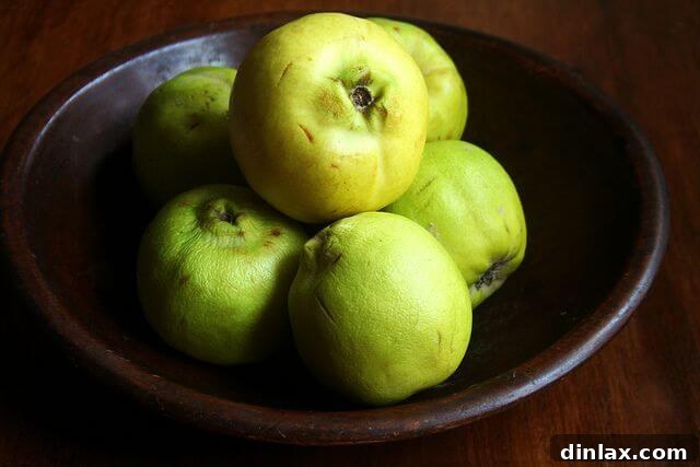 Bowl of fresh quinces ready for making membrillo