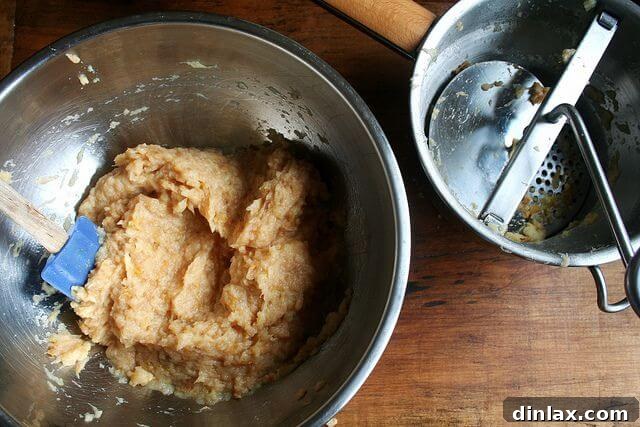 Quince simmering in a saucepan for membrillo