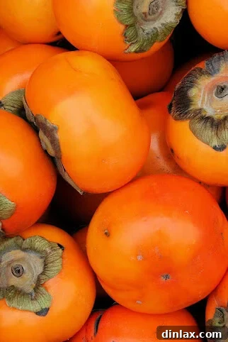 Close-up of a finished persimmon panini, sliced diagonally to show the layers.