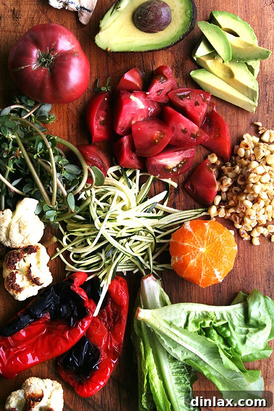 Fresh Vegetables for an End-of-Summer Salad Vibrant collection of fresh, seasonal vegetables including corn, peppers, and greens, ready for a healthy salad.