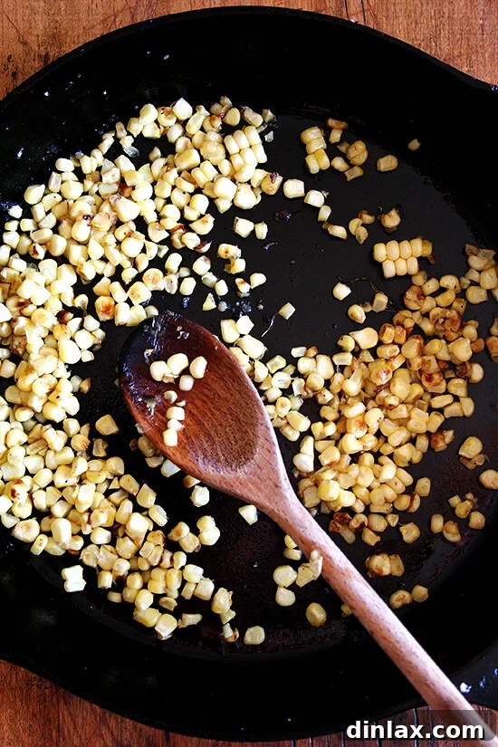 Sautéed Corn: The Perfect Salad Topper A simple yet elegant salad featuring sautéed corn as a topping, showcasing its golden color and inviting texture.