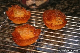 Spiced Pumpkin Delight 4 A simple yet charming Thanksgiving decoration, a turkey figurine crafted from a pine cone and colorful pipe cleaners, evoking holiday warmth.
