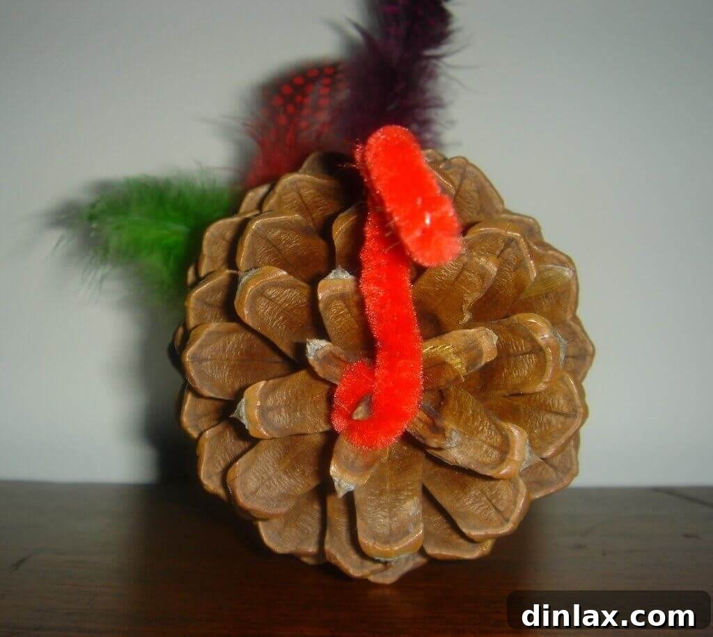Spiced Pumpkin Delight 5 Another handcrafted turkey decoration, meticulously made from a pine cone, pipe cleaners, and googly eyes, adding a whimsical touch to holiday decor.