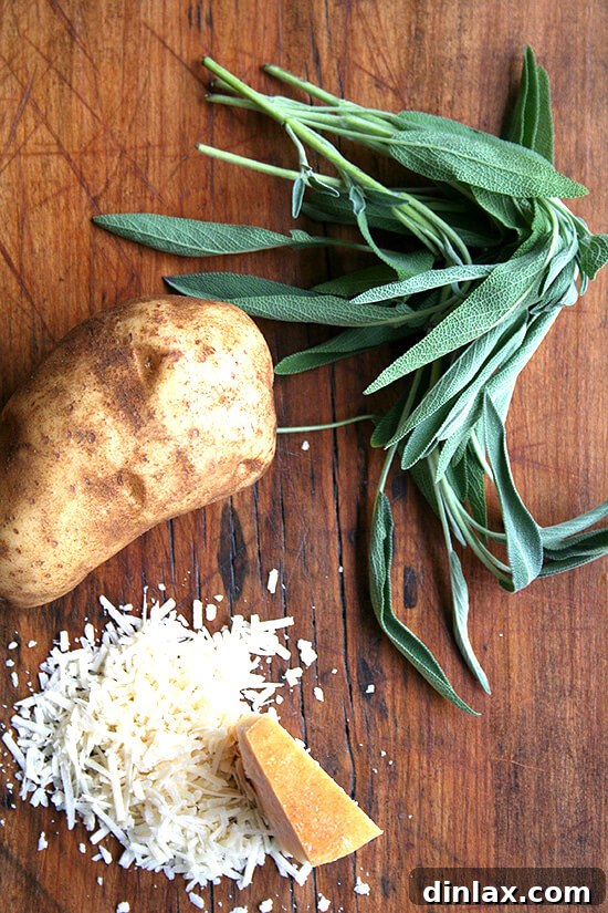 Fresh sage, russet potatoes, and grated Parmesan cheese, key ingredients for homemade gnocchi.