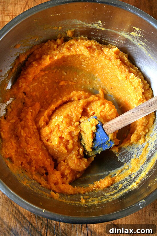 Mixing the gnocchi dough, combining pureed squash, riced potatoes, and flour by hand.