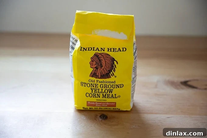 A package of high-quality stone ground yellow cornmeal, often used for dusting no-knead bread to enhance crust.