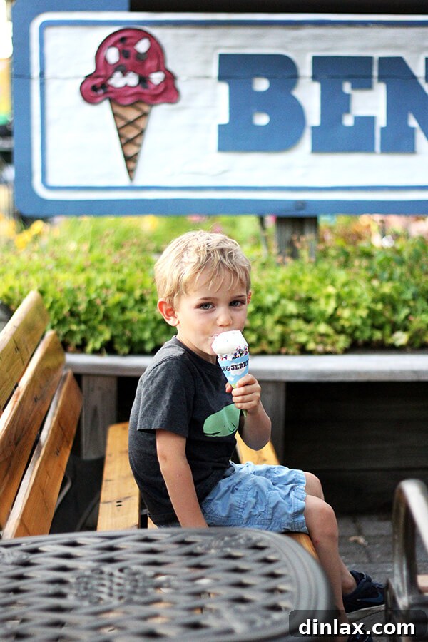 Graham's ice cream delight Graham enjoying a refreshing ice cream treat on a warm Lake George day, a perfect summer indulgence.
