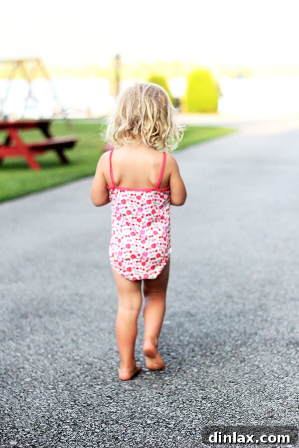 The Queen of American Lakes 2 Wren, full of excitement, walking towards the inviting, clear waters of Lake George beach, ready for another day of splashing and fun.