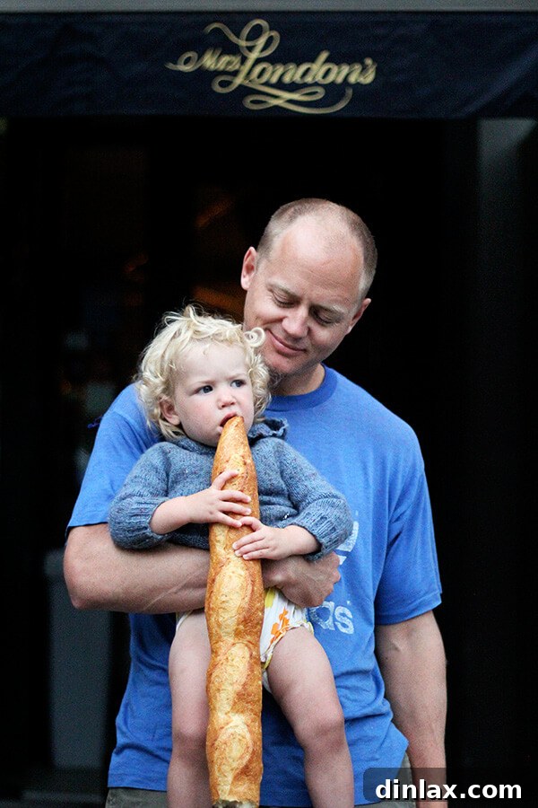 The Queen of American Lakes 20 Baby Tig happily eating a fresh baguette from Mrs. London's in Saratoga, enjoying the delicious bread on the journey home.