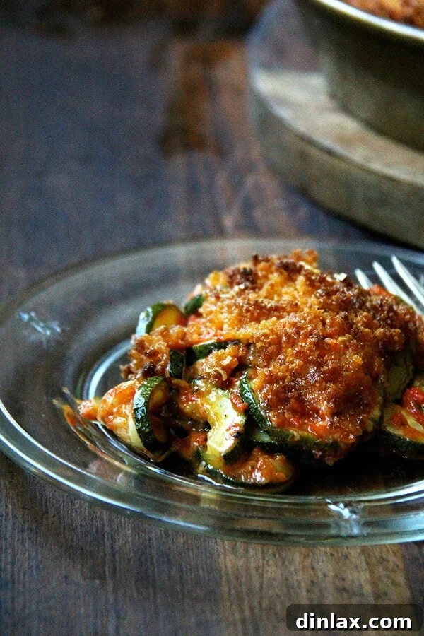 A perfect slice of Zucchini Parmesan, revealing its delicious layers.