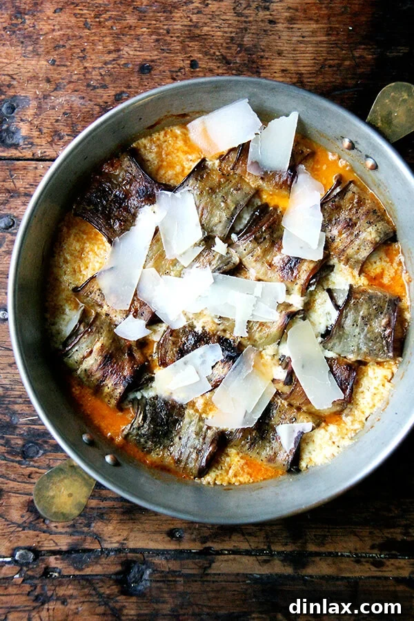 Just-baked eggplant involtini, garnished with freshly shaved Parmesan, shimmering and irresistible.