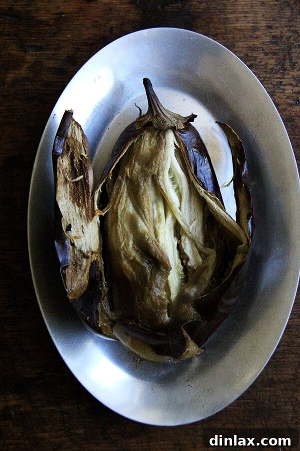 Split open eggplant revealing soft flesh