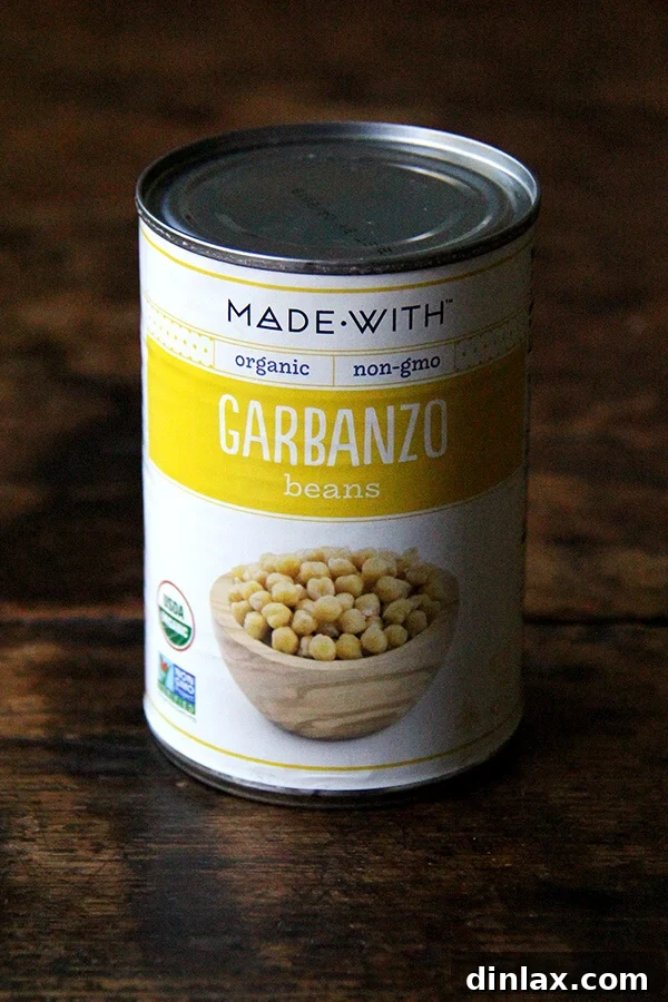 A standard can of chickpeas, ready to be opened, a common source for aquafaba.