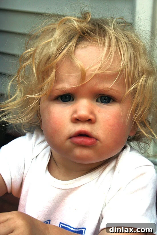 My Little Kitchen Assistant A joyful child, the kitchen assistant, caught in the act of tasting the gratin.