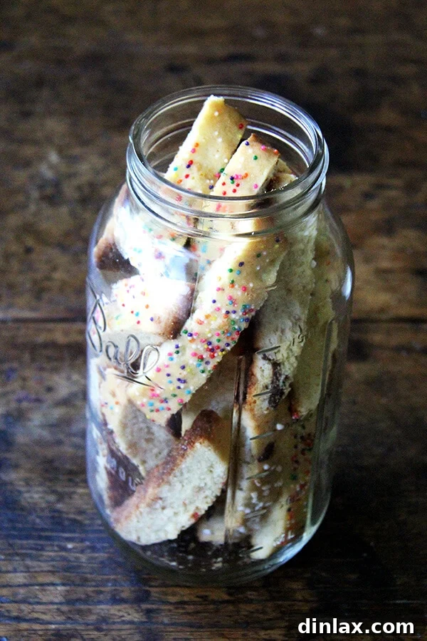 Enjoying Mandel Bread with Marzipan & Sea Salt: A Perfect Coffee Companion A stack of beautifully sliced Mandel bread cookies, showcasing the texture and toppings.