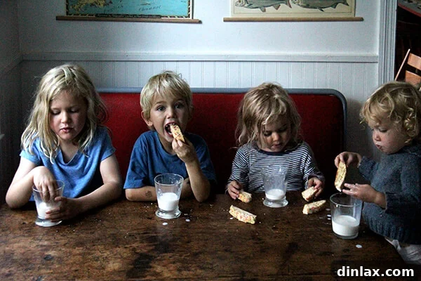 Sweet and Salty Marzipan Mandel Bread 10 Children intently enjoying slices of Mandel bread, indicating their delight.
