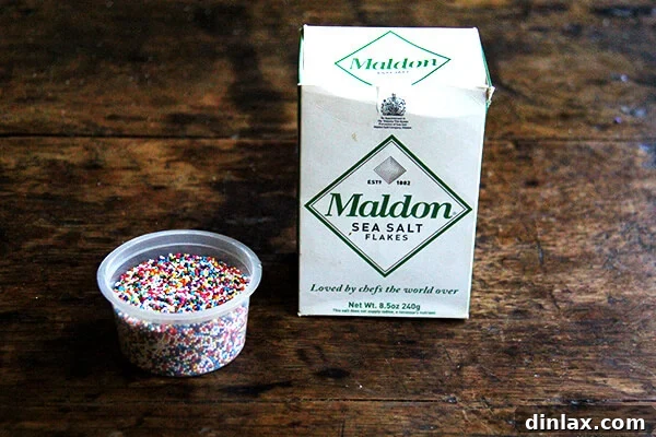 Sweet and Salty Marzipan Mandel Bread 2 Close-up of baked Mandel bread topped with colorful sprinkles and flaky sea salt.