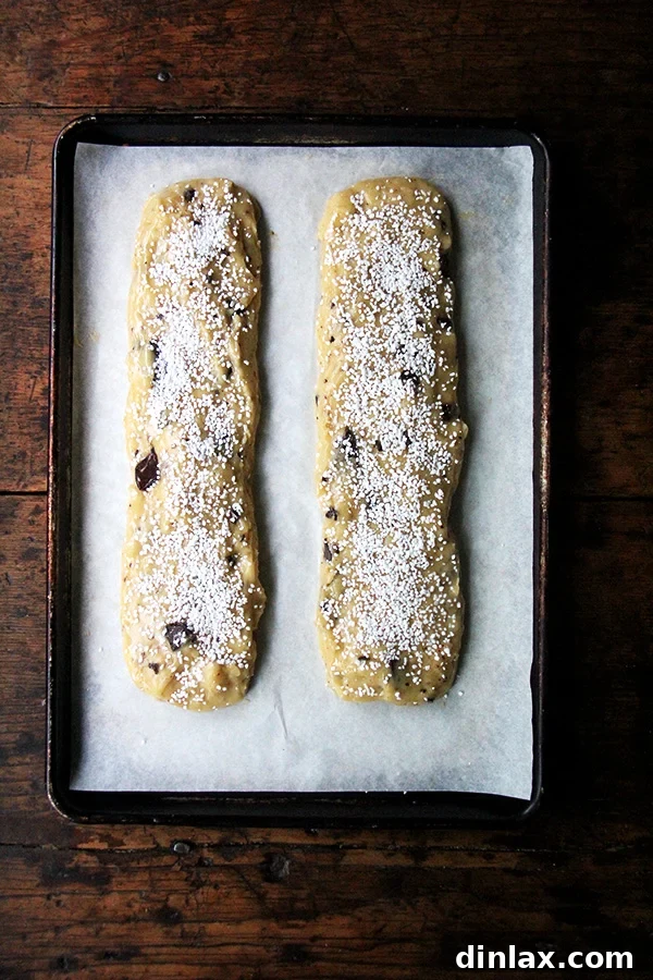 Sweet and Salty Marzipan Mandel Bread 6 Mandel bread loaves topped with glistening pearl sugar before baking.